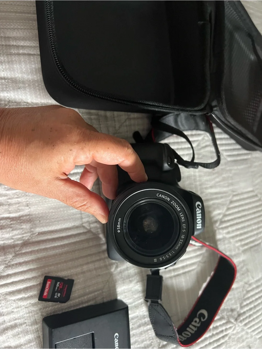 Canon Black DSLR with 18-55mm Lens and Red-Trim Strap